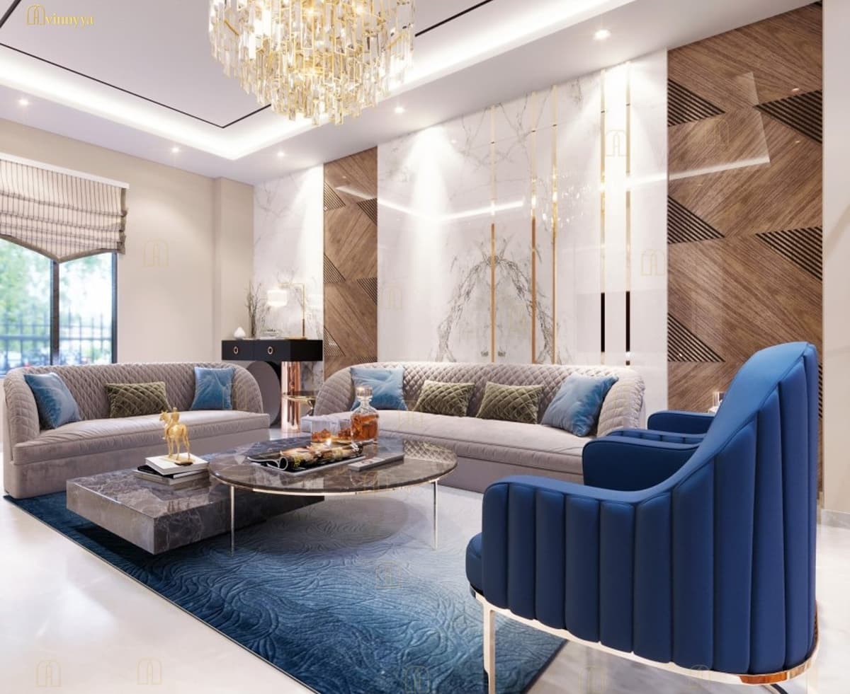 Living room with marble and wood panelling and a blue velvet armchair — Aurelia, Varanasi