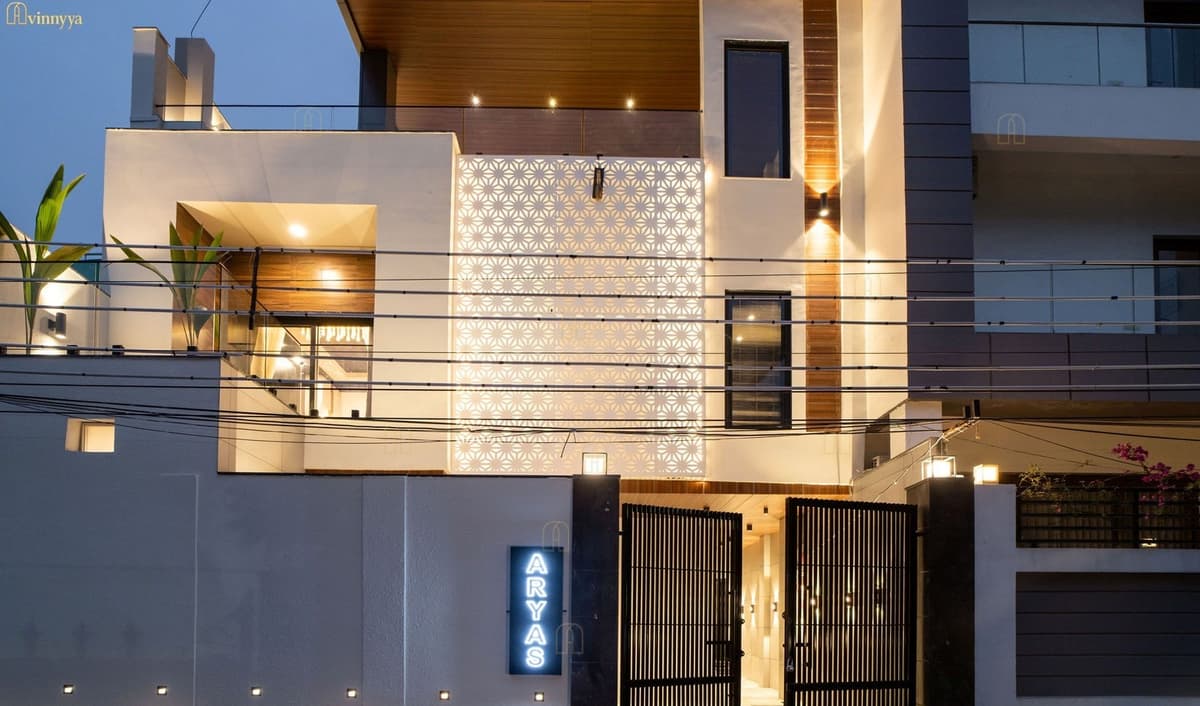 Restored bungalow facade lit at night — Aurelia, Varanasi