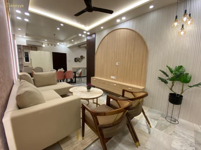 Compact living room with an arched wood panel — Emma, Bangalore