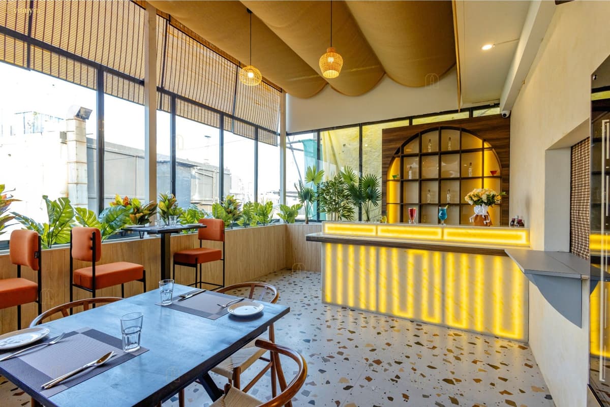 Restaurant with a draped fabric ceiling and glowing bar — Tastique, Bangalore