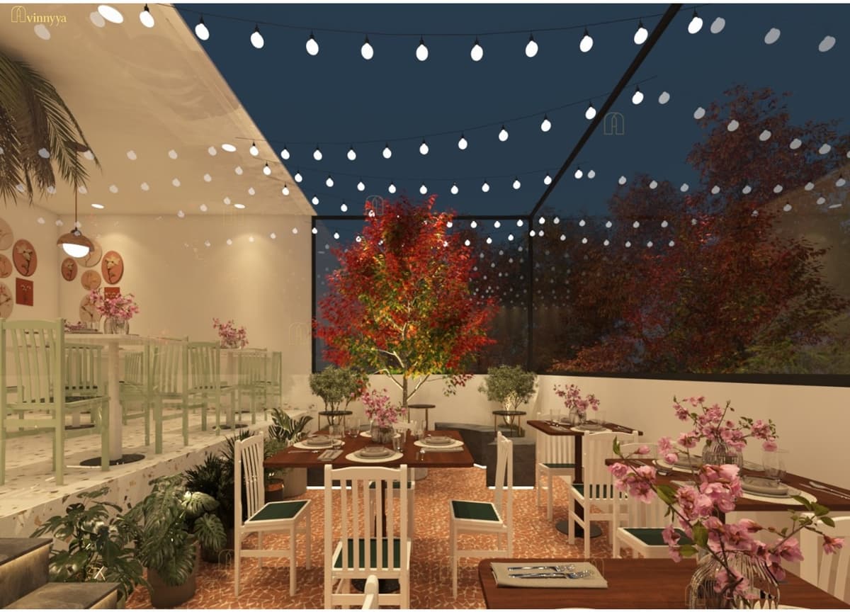 Rooftop dining area lit with string lights at night — Rangoon Palace, Varanasi